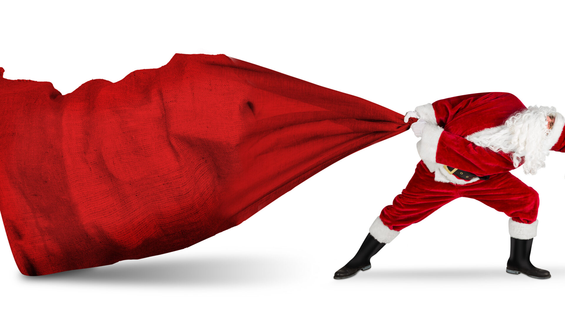 classic traditional crazy funny santa claus on exhausting delivery service. towing huge giant big red bag with christmas gift present  isolated  white background